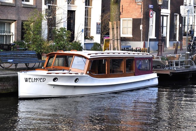 Private Champagne Canal Cruise in Amsterdam - Daylight, evening, and rainy-weather choices