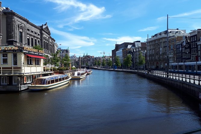 Private Tour: Amsterdam City Walking Tour and Canal Cruise - Walking demands, weather, and meeting details
