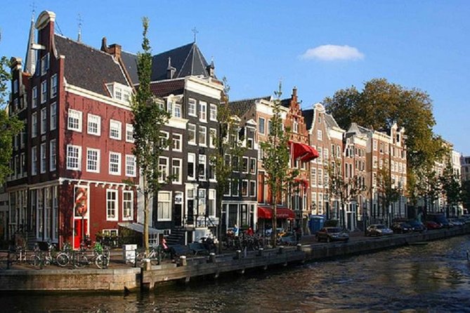Secrets of Amsterdam Walking Tour plus Dutch Sweets Tasting - Munt Tower and the city’s defensive past