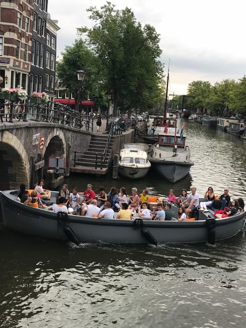 Visit Amsterdam by Boat with a French Guide (french) - Centraal Station and the old center